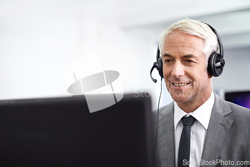 Image of Modern telecommunications in business. A friendly customer support agent answering the phone.