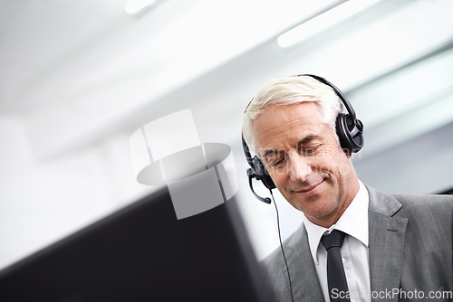 Image of Im listening...A friendly customer support agent answering the phone.