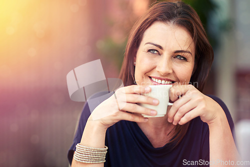 Image of Enjoying a relaxed cuppa. a woman drinking a cup of coffee.