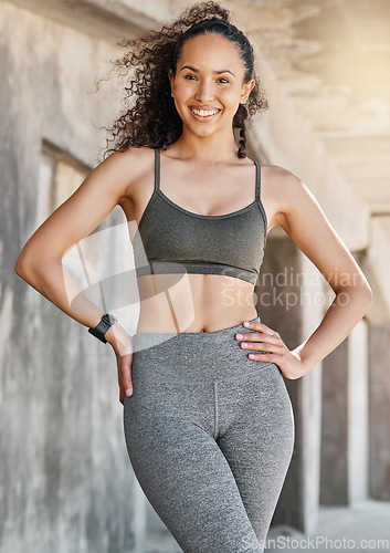 Image of Work hard pays off. an attractive young woman standing alone in the city during her outdoor workout.