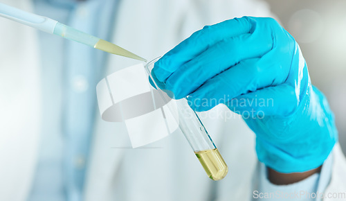 Image of Im determined to find a cure. an unrecognisable scientist using a test tube and dropper in the laboratory.