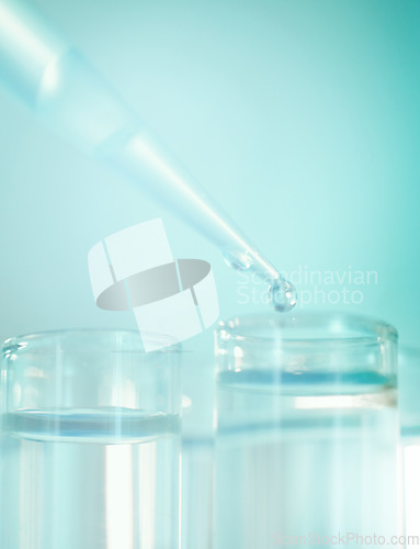 Image of Ive got more than enough testers. a dropper and beakers in a laboratory.