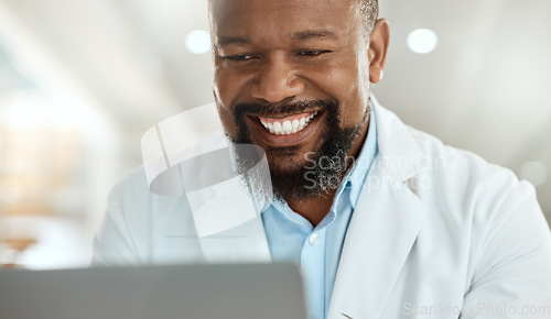 Image of Ive got a clear overview after running tests. a handsome mature scientist sitting alone in his laboratory and using his laptop.