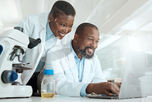 Image of We can discover a cure together. two scientists using a laptop in a laboratory.