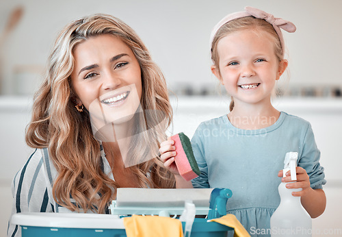 Image of Little caucasian girl helping her mother with household chores at home. Happy mom and daughter excited to do spring cleaning together. Kid learning to be responsible by doing tasks