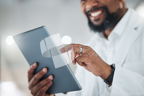 Image of My research will contribute to a whole lot more. a male scientist using a digital tablet while working in a lab.