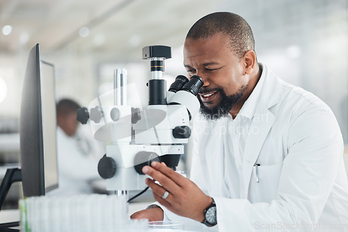 Image of New samples have come in for the case study at hand. a mature man using a microscope in a lab.