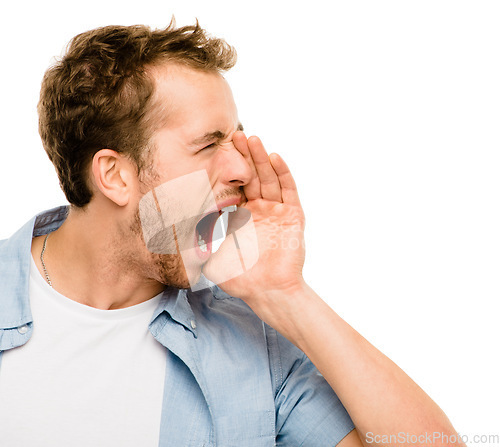 Image of Letting his emotions fly free. a young man shouting against a studio background.