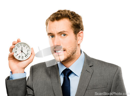Image of Hes always on the clock. a businessman holding a clock against a studio background.