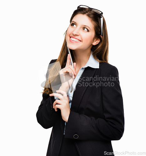 Image of Good idea, lets go with it. a young businesswoman day dreaming against a studio background.