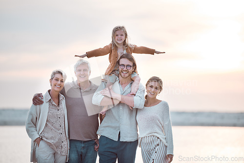 Image of We love spend time together as a family. a multi-generational family spending the day at the beach.