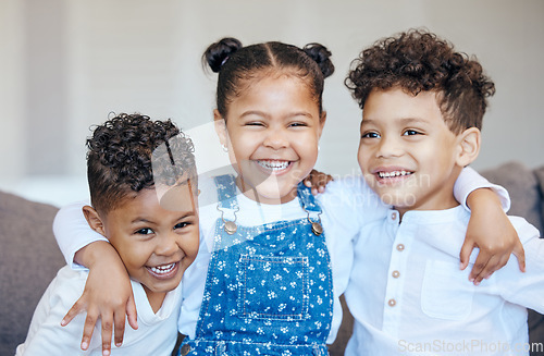 Image of Three happy and adorable mixed race kids having fun and laughing together at home. Group of boys and girl siblings or cousins playing and bonding while growing up together. The innocence of childhood