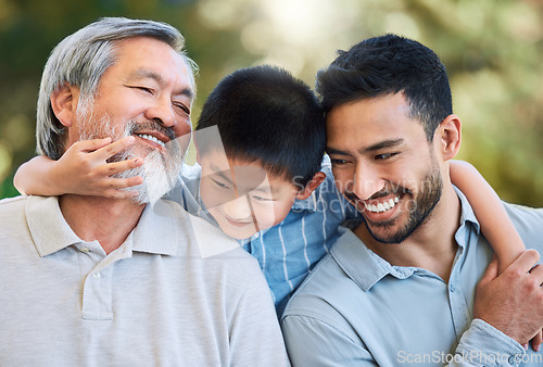 Image of Three generations of joy. an adorable little boy spending a fun day in the park with his father and grandfather.