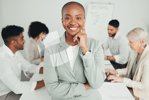 Image of A friendly boss. a young businesswoman standing in a meeting at work.