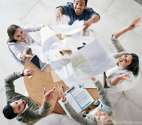 Image of Success means doing the best we can. Aerial shot of a diverse group of businesspeople throwing paperwork in the air in celebration while in the office.