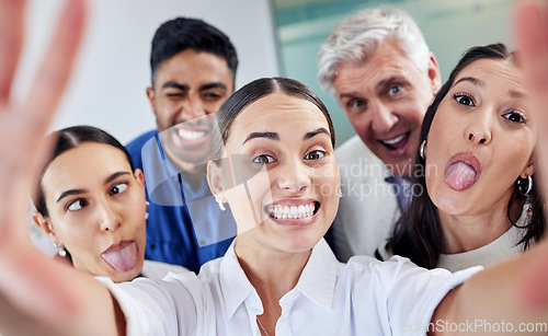 Image of Take time to unleash your inner child. a group of businesspeople taking a selfie at work.