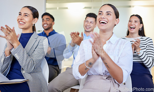 Image of That presentation was great. a group of businesspeople clapping in a meeting at work.