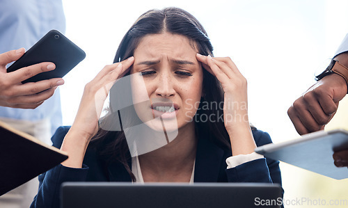 Image of You can’t always control what goes on outside. a young businesswoman feeling stressed out in a demanding office environment at work.