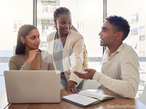 Image of He explains things so well. a group of businesspeople having a meeting in an office at work.