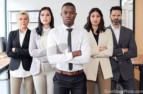 Image of Theres nothing we cant do. a group of businesspeople standing in an office at work.