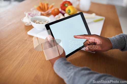 Image of Cant cook The internet can help. an unrecognizable man using a digital tablet while cooking at home.