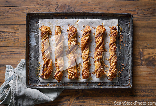 Image of freshly baked pastries with chocolate cream and almonds