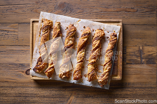 Image of freshly baked pastries with chocolate cream and almonds