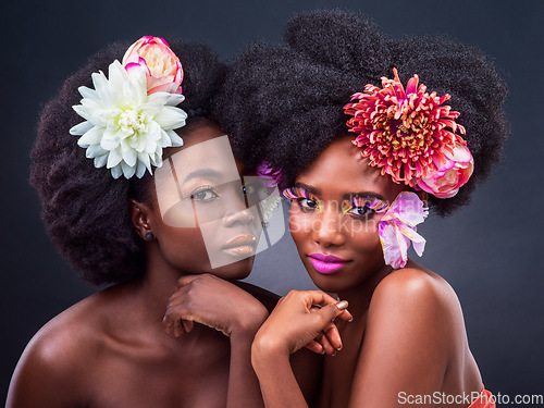 Image of Flowers need time to bloom, so do you. two beautiful women posing together with flowers in their hair.