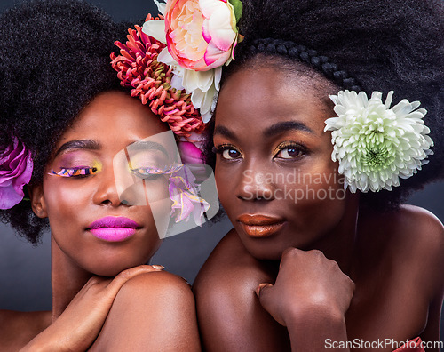 Image of You dont need anything but flowers. two beautiful women posing together with flowers in their hair.