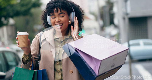 Image of Headphones, shopping bag or happy woman in city for boutique retail sale, or clothes discount deal. Coffee, financial freedom or rich customer walking on street streaming radio music with fashion