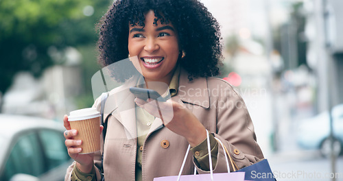 Image of Happy woman, coffee and phone for communication for outside, city and street for commute. African, business person and smile with shopping bags while talking on mobile with app, network or internet