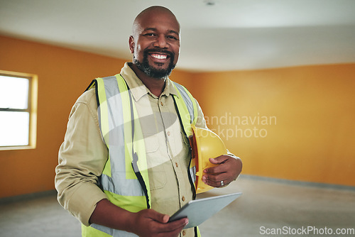 Image of The smartest tool in a safety inspectors arsenal. a confident man using a digital tablet while working at a construction site.