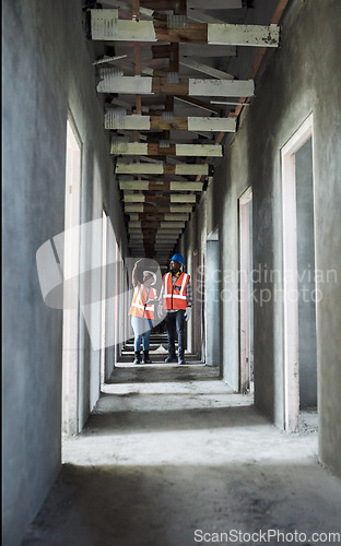 Image of Wall to wall exceptional work. a young man and woman using a digital tablet while working at a construction site.