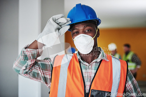 Image of Our safety rules are the most important tools. Portrait of a confident young man working at a construction site.