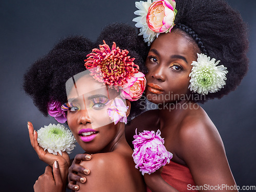 Image of We have nothing to hide and everything to show. two beautiful women posing together with flowers in their hair.