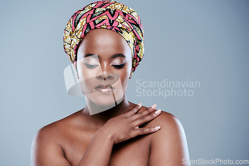 Image of Nothing can bring a confident woman down. Studio shot of a beautiful young woman posing against a grey background.