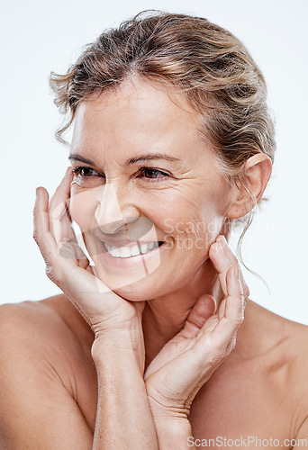 Image of Rise and shine with beautiful glowing skin. a beautiful mature woman posing against a white background.