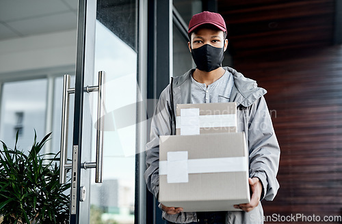 Image of Wherever you are, well get it delivered. a masked young man delivering a package to a place of residence.