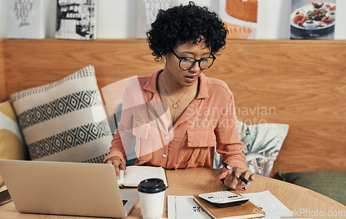 Image of Youre capable of doing whatever you put your mind to. a businesswoman using her laptop while working at a cafe.