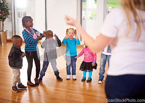 Image of Every child needs someone to look up to. a volunteer working with little children.