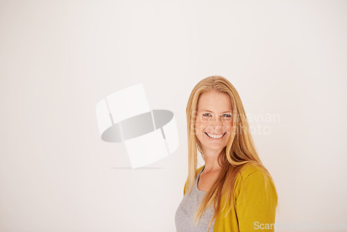 Image of Looking forward to a sunny day. Portrait of a happy woman posing against a light background.