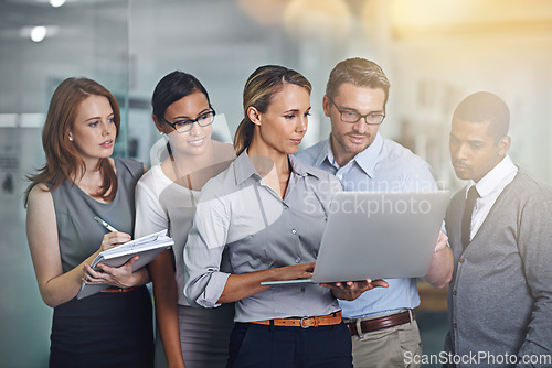 Image of Together you can turn any failure in to success. a business team working on a laptop together.