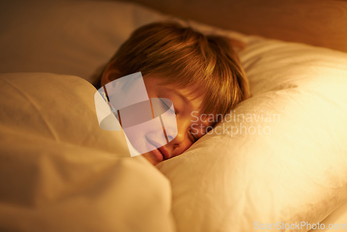 Image of He always sleeps so peacefully. a little boy asleep in his bed.