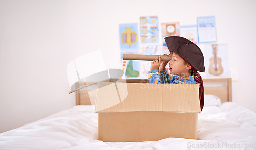 Image of Roaming the seven seas. a young boy playing make believe as a pirate.