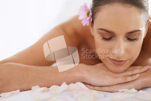 Image of Taking care of her inner girl. Closeup of a beautiful young woman lying on a massage table.