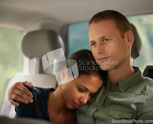 Image of I was hoping shed keep me compnay a while longer...A beautiful woman falling asleep on her husbands shoulder while travelling.