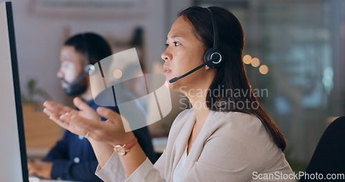 Image of Business woman, call center and computer for night customer service, e commerce support and help in office. Professional consultant or Asian agent with website solution, questions or FAQ in workspace