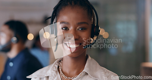 Image of Portrait, smile and black woman at call center on headphones for crm support on bokeh at night. Face, happy sales agent and telemarketing consultant, customer service professional or worker in office