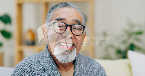 Image of Portrait, smile and senior man with retirement, relax and glasses with a break, home and pensioner in a living room. Face, elderly person and mature guy with eyewear, retired and aged in a lounge