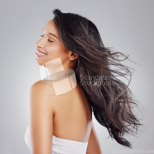 Image of Beautiful things don’t ask for attention. an attractive young woman posing in studio against a grey background.